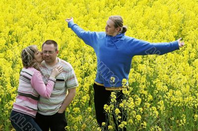 Three people in meadow