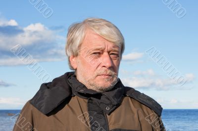 Portrait of middle-aged man at the sea.