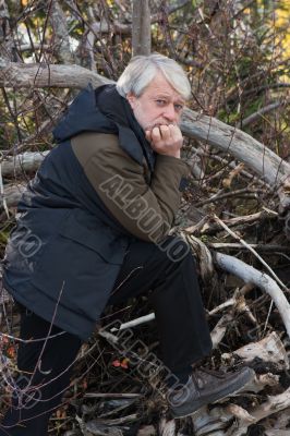 Middle-aged man in forest.