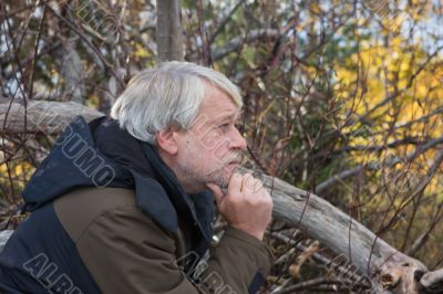 Middle-aged man in forest.