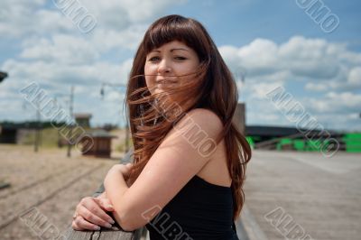 Beauty girl on the old-time bridge.