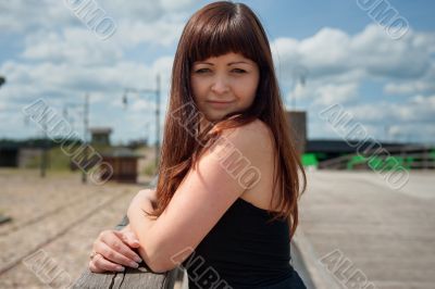 Beauty girl on the old-time bridge.