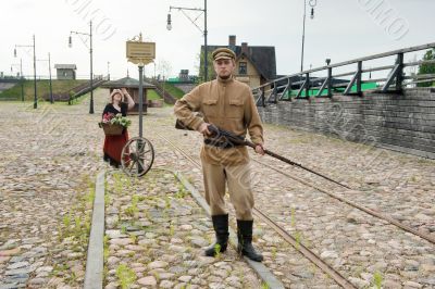 Lady and soldier with  gun in retro style picture