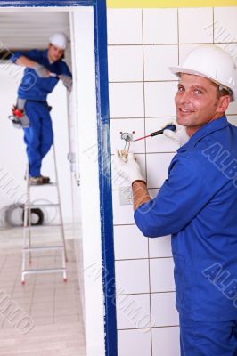 duo of electricians indoors