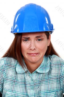 A crying female construction worker.