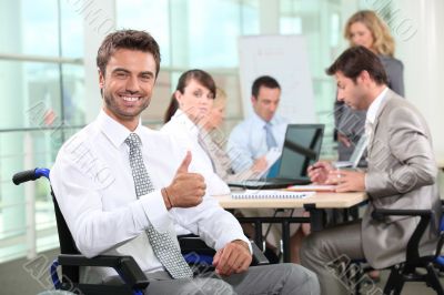 Disabled businessman smiling in office