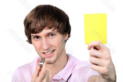 Referee showing the yellow card Referee showing the yellow card