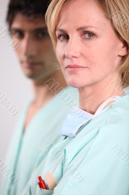 Blond nurse stood with male colleague