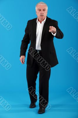 mature businessman pressing button