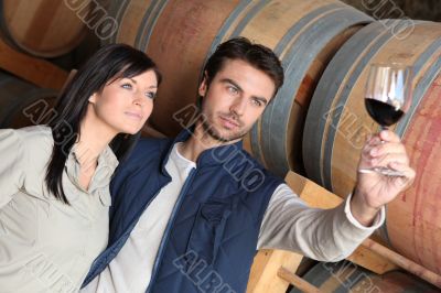 Couple wine tasting in a cellar