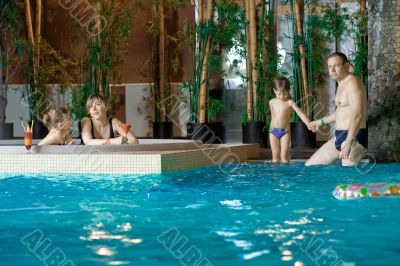 Family in swimming-pool