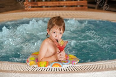 Boy with glass of coctail