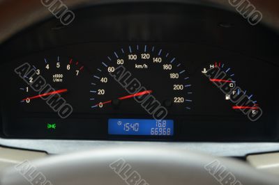 speedometer and a tachometer, level of fuel and temperature