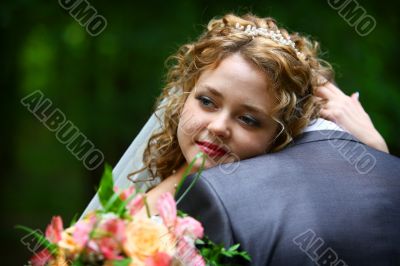 Bride embracing groom