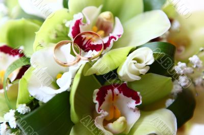 Two rings and wedding bouquet