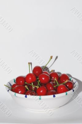 many red cherries in a bowl