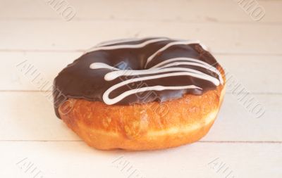 Donut covered in chocolate icing and sprinkles