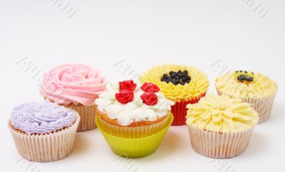 Variety of cupcakes with decorative techniques