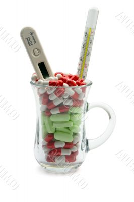Glass full vitamin and two thermometers 