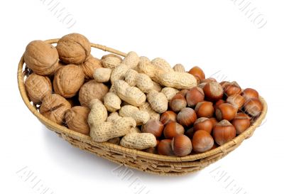 Set of nuts in a wicker basket, isolation