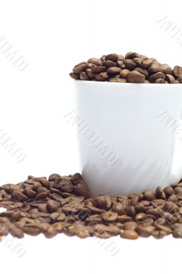 coffee beans in a cup isolated on white background