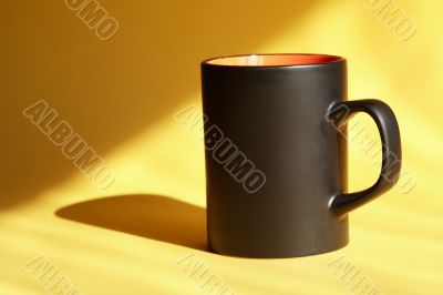 Black Mug On Yellow