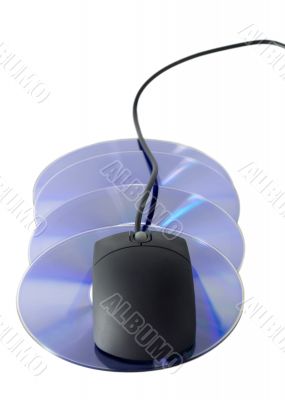 Computer mouse on stack CD / DVD Computer mouse on stack CD / DVD