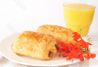 Chocolate croissants and orange juice Chocolate croissants and orange juice
