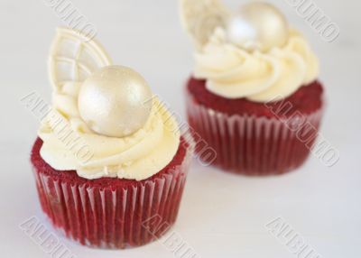 Red velvet cupcakes with icing and decorations