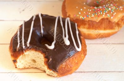 Donuts covered in caramel and chocolate icing 