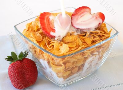 Bowl of breakfast cornflakes with strawberries