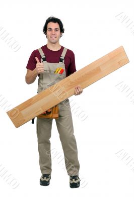 Handyman carrying plank on white background