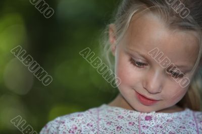 little blonde girl watching down look amused