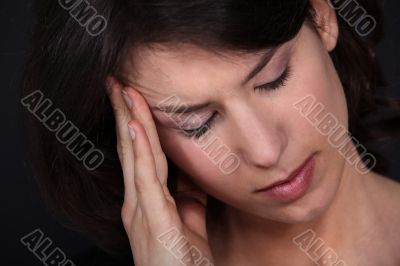 Closeup of a woman with a headache