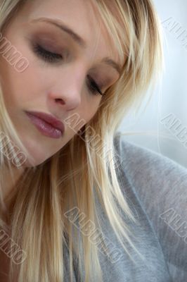 Blond woman looking sad