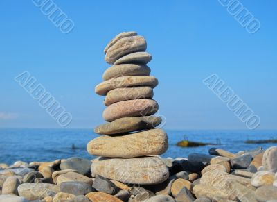 Balanced stones on the seashore summertime