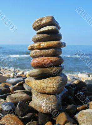 Balanced stones on the seashore summertime