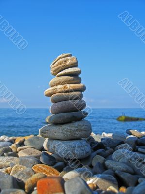 Balanced stones on the seashore summertime