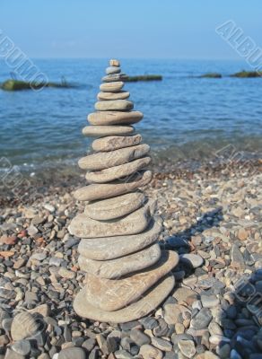 Balanced stones on the seashore summertime