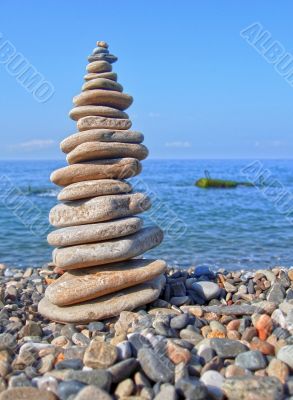 Balanced stones on the seashore summertime