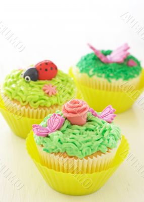 Vanilla cupcakes with various decorations