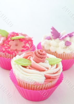 Vanilla cupcakes with various decorations