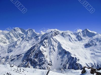 Caucasus mountains under the snow and clear sky