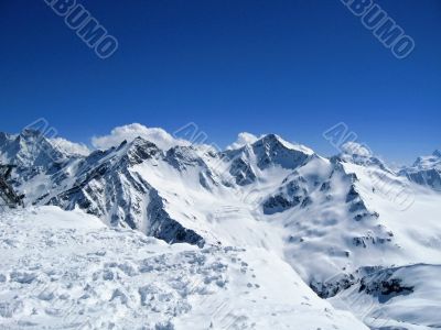 Caucasus mountains under the snow and clear sky