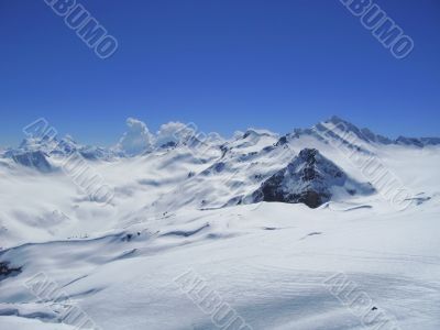 Caucasus mountains under the snow and clear sky