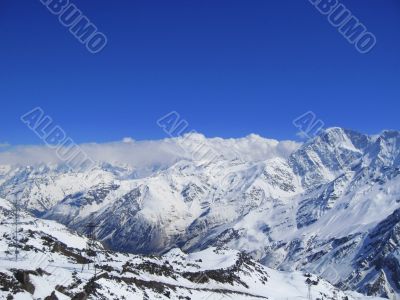 Caucasus mountains under the snow and clear sky