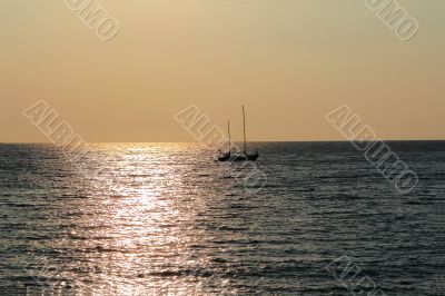 Seascape with calm water and sailboat
