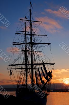 Tall ship silhouette at sunset