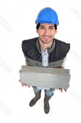 Builder with a block in his hands