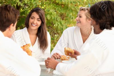 Four friends sharing breakfast